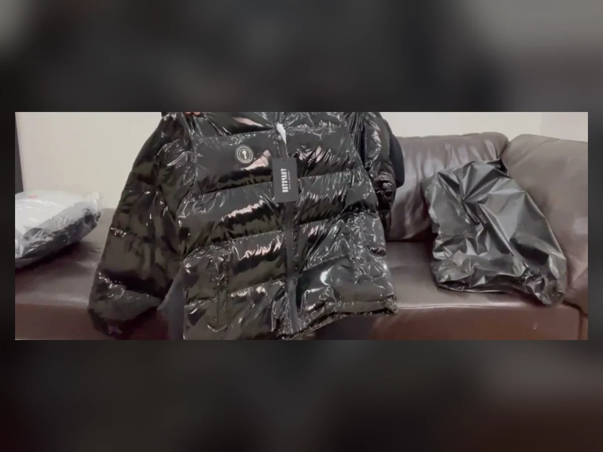 Exact black Trapstar Irongate puffer held up during an unboxing